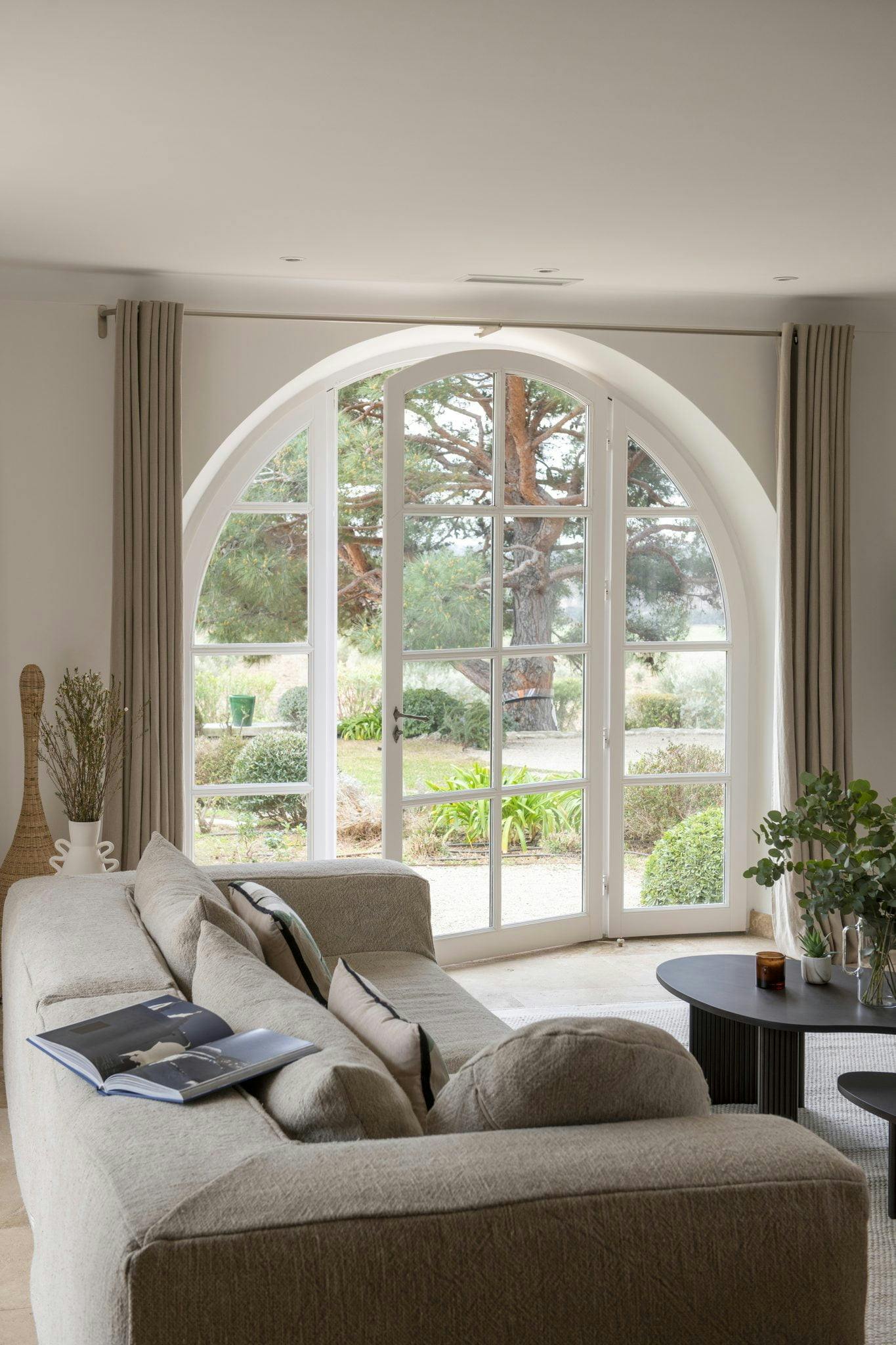 Living room with sofa and arched window