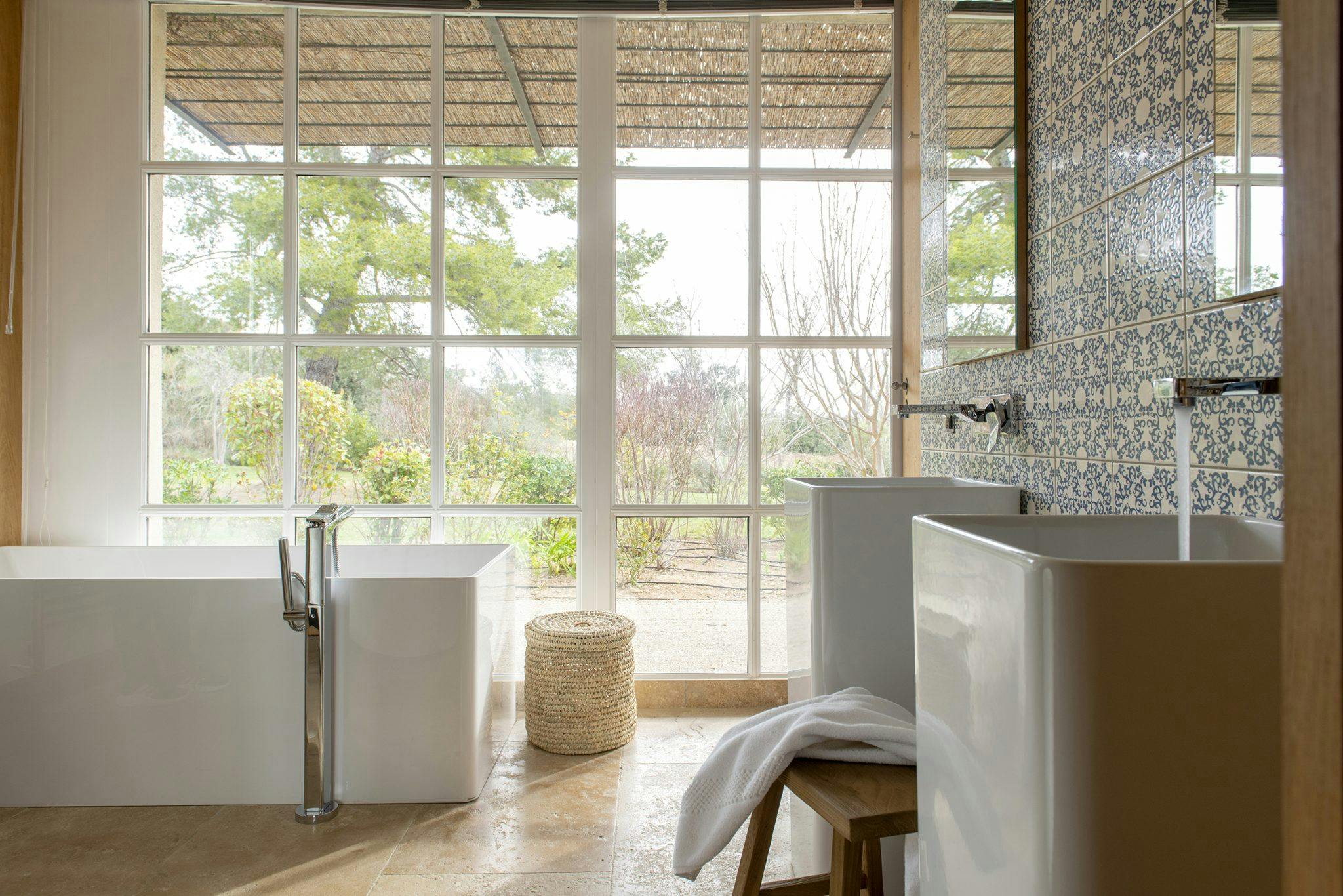 bathroom with bath and view