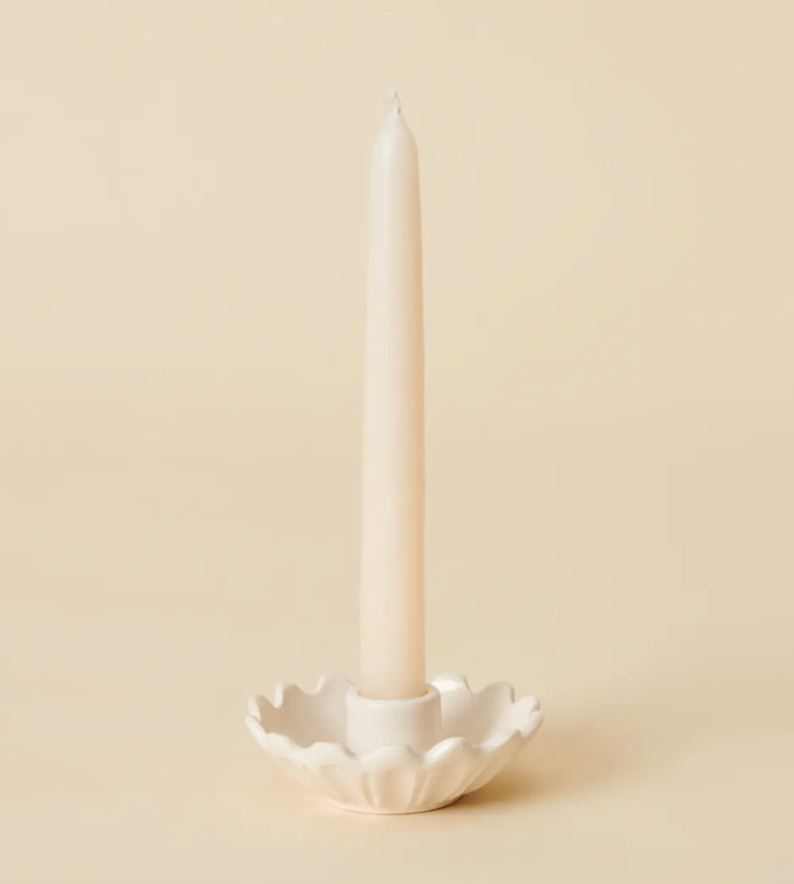 white ceramic candleholder with candle