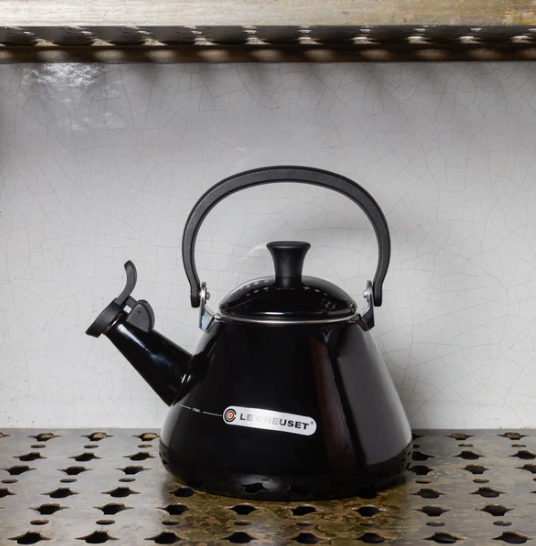 black tea kettle in a kitchen shelf