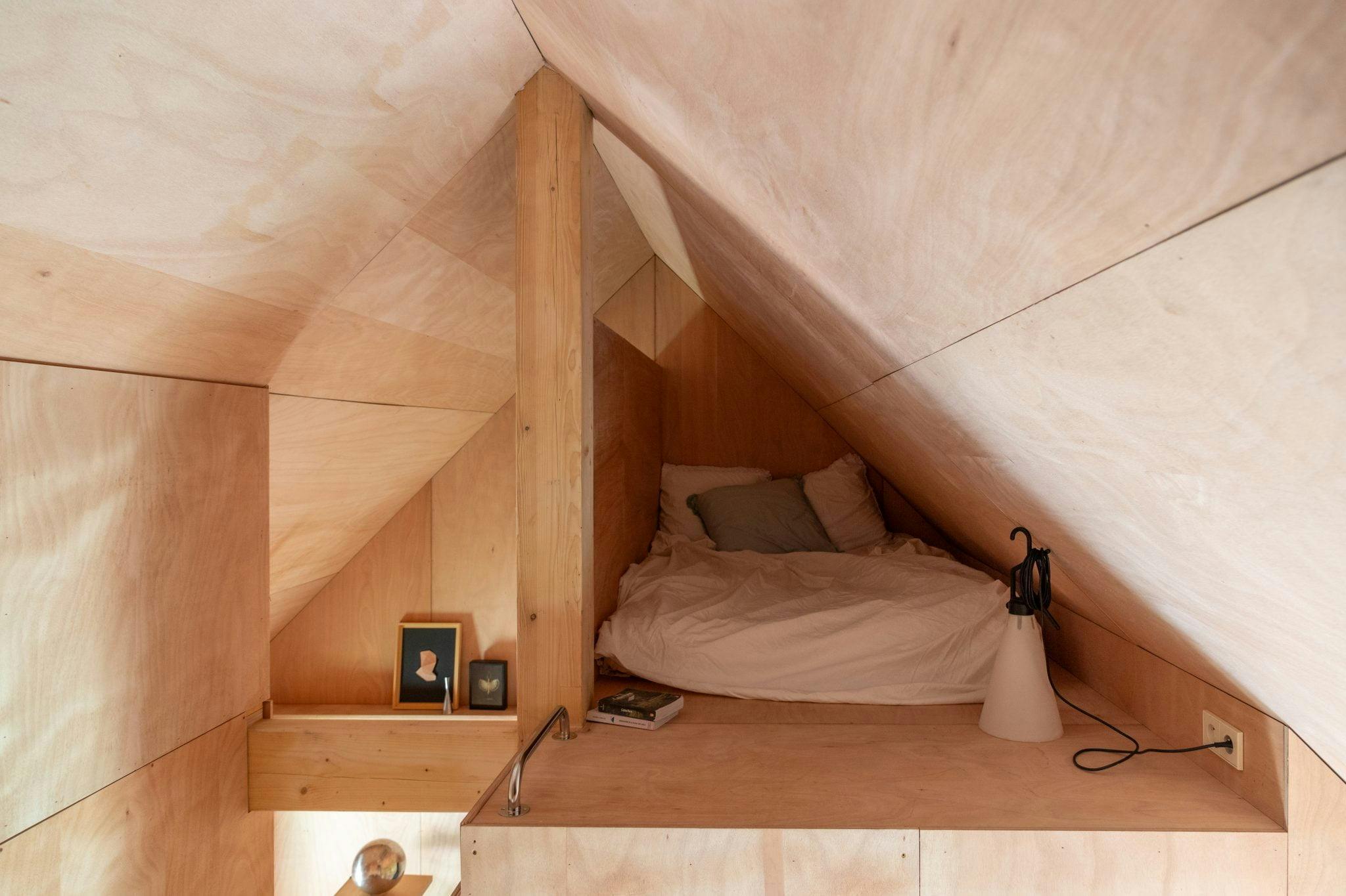 bedroom under the roof of the house, cabin