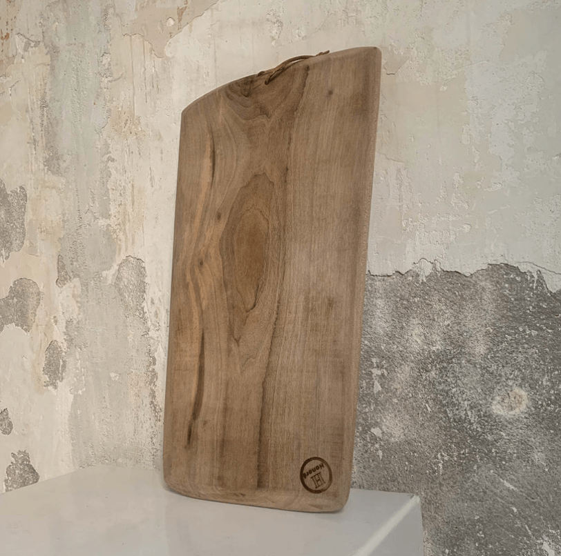 wooden chopping board with a gray background