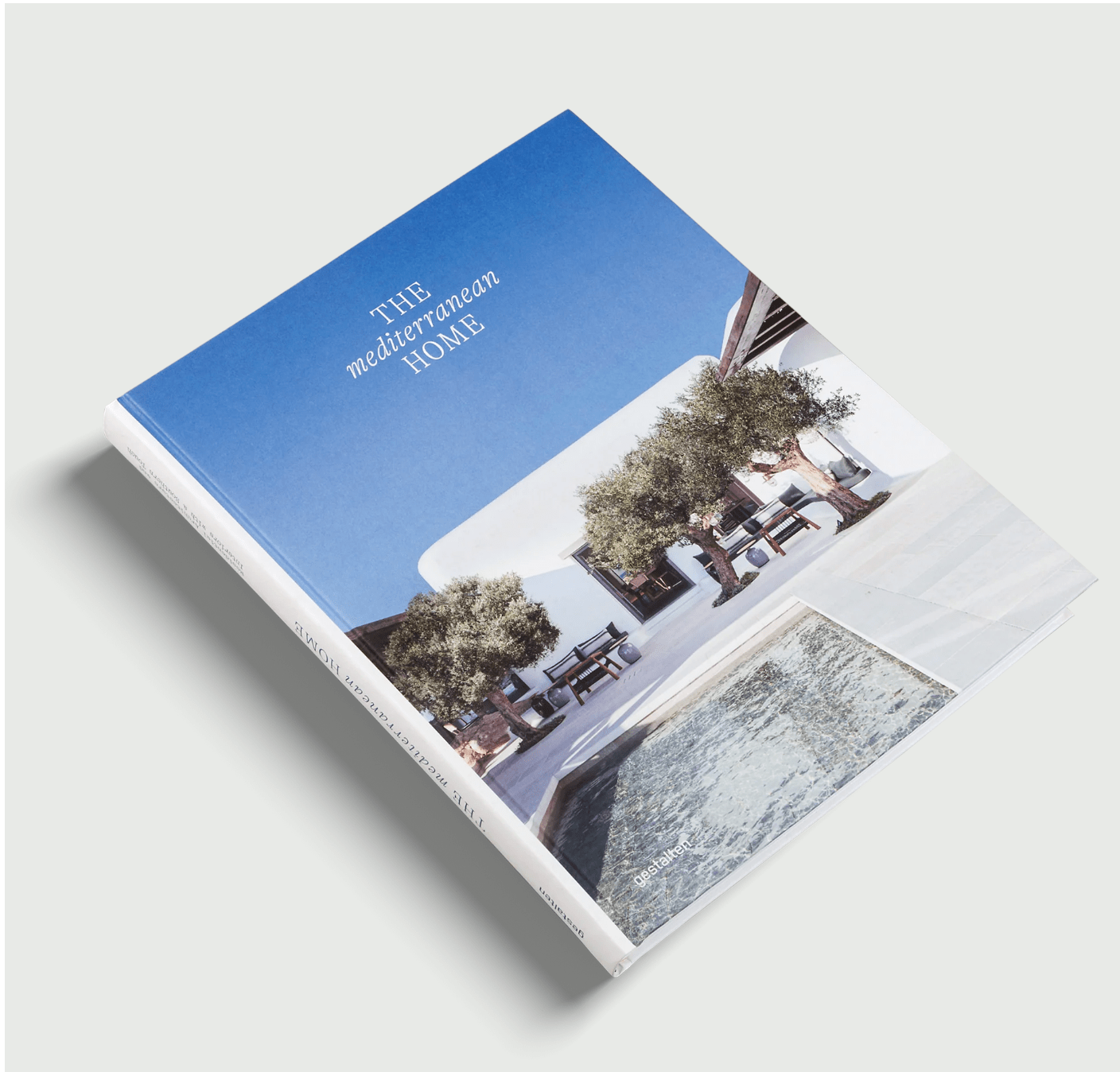 book with a cover featuring a pool and olive trees