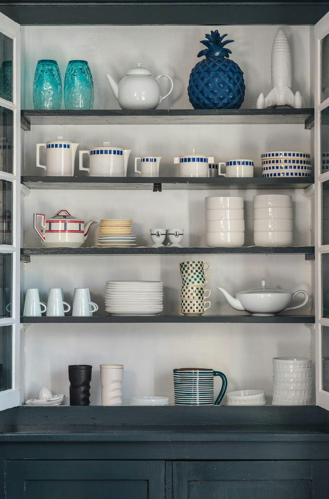 blue buffet and shelving for crockery