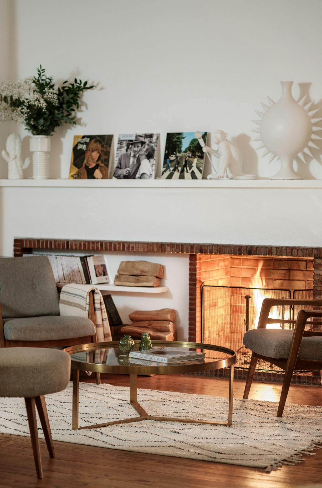 lounge decorated with vinyl and armchair by the fire