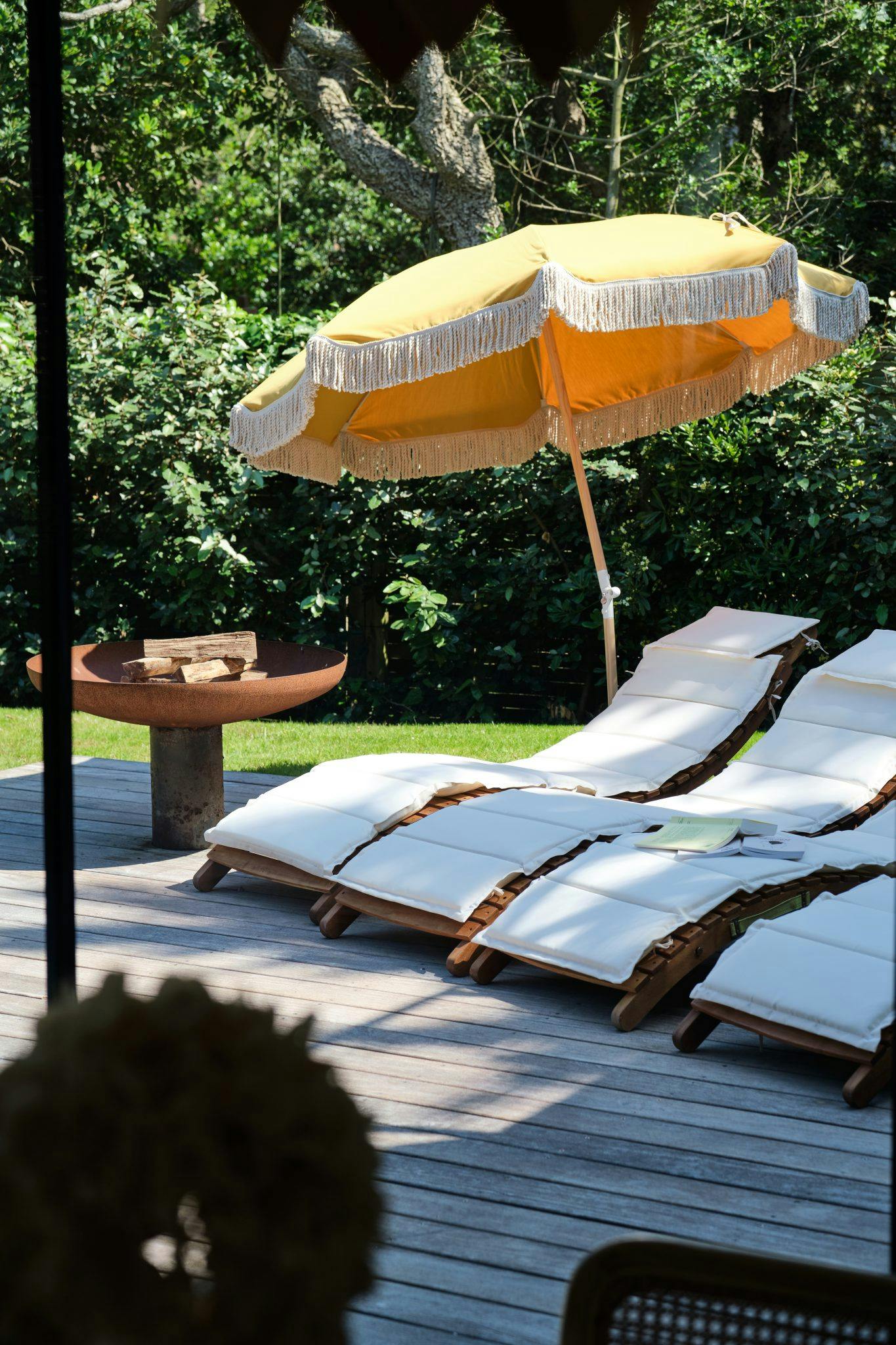 deckchair and parasol by the pool