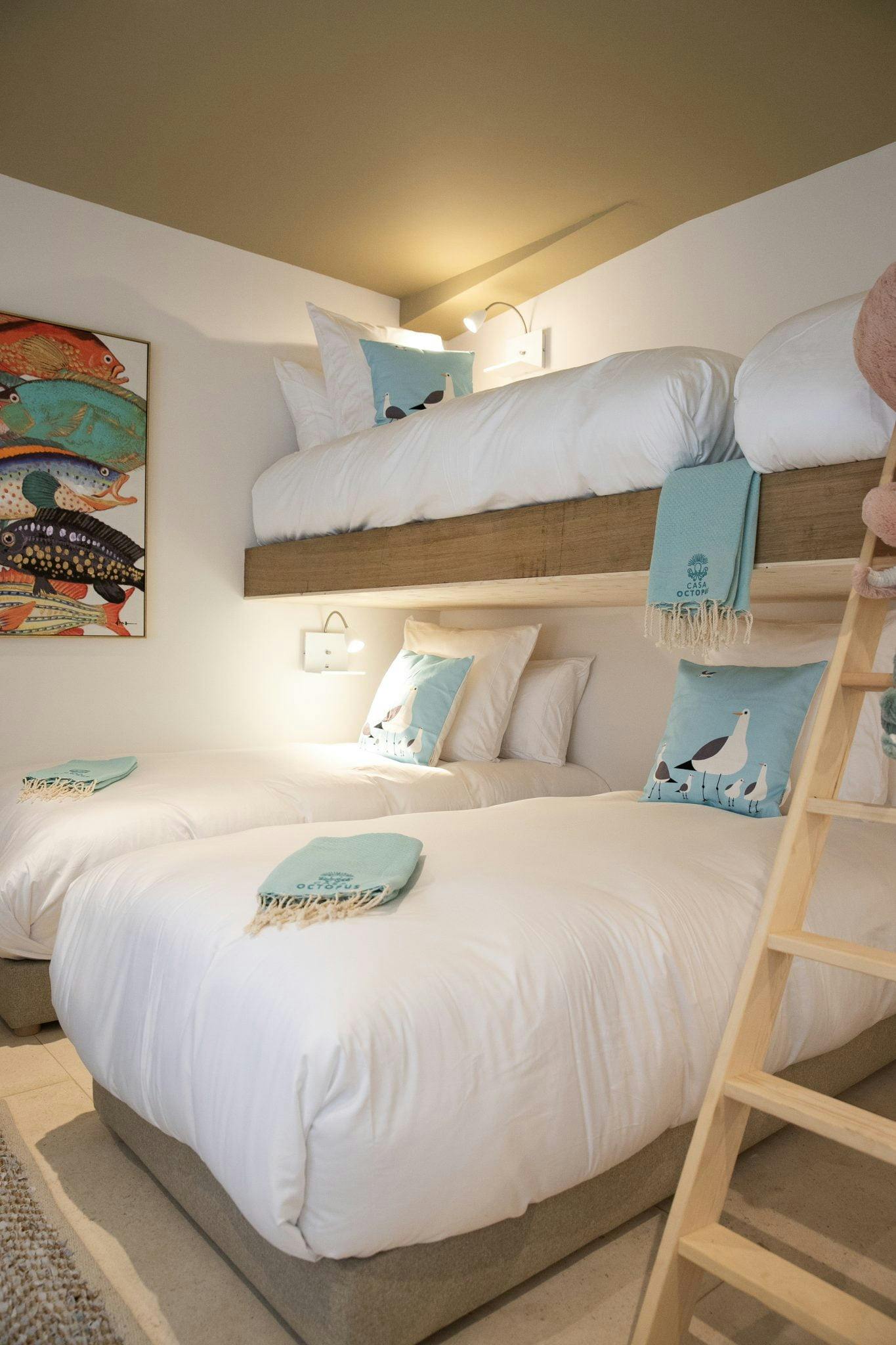 Children's bedroom with mezzanine beds and sea-themed décor
