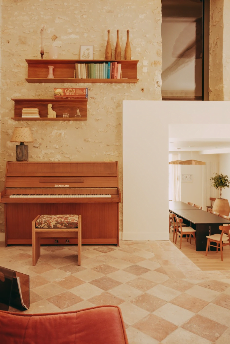 The living room: piano, sofa, decoration