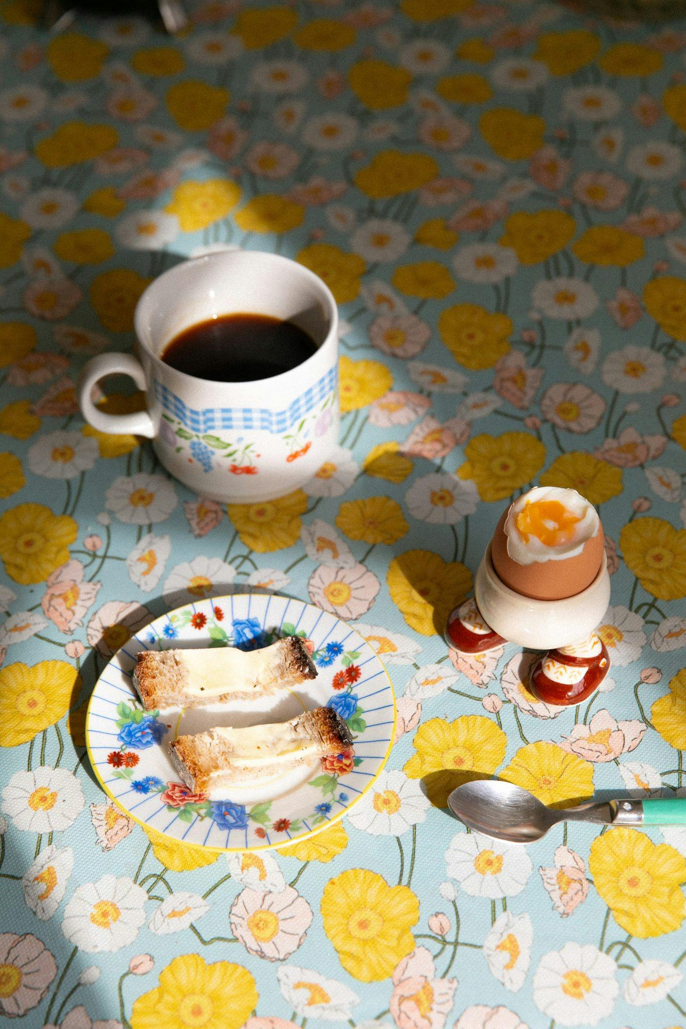 Boiled egg and coffee on the kitchen table