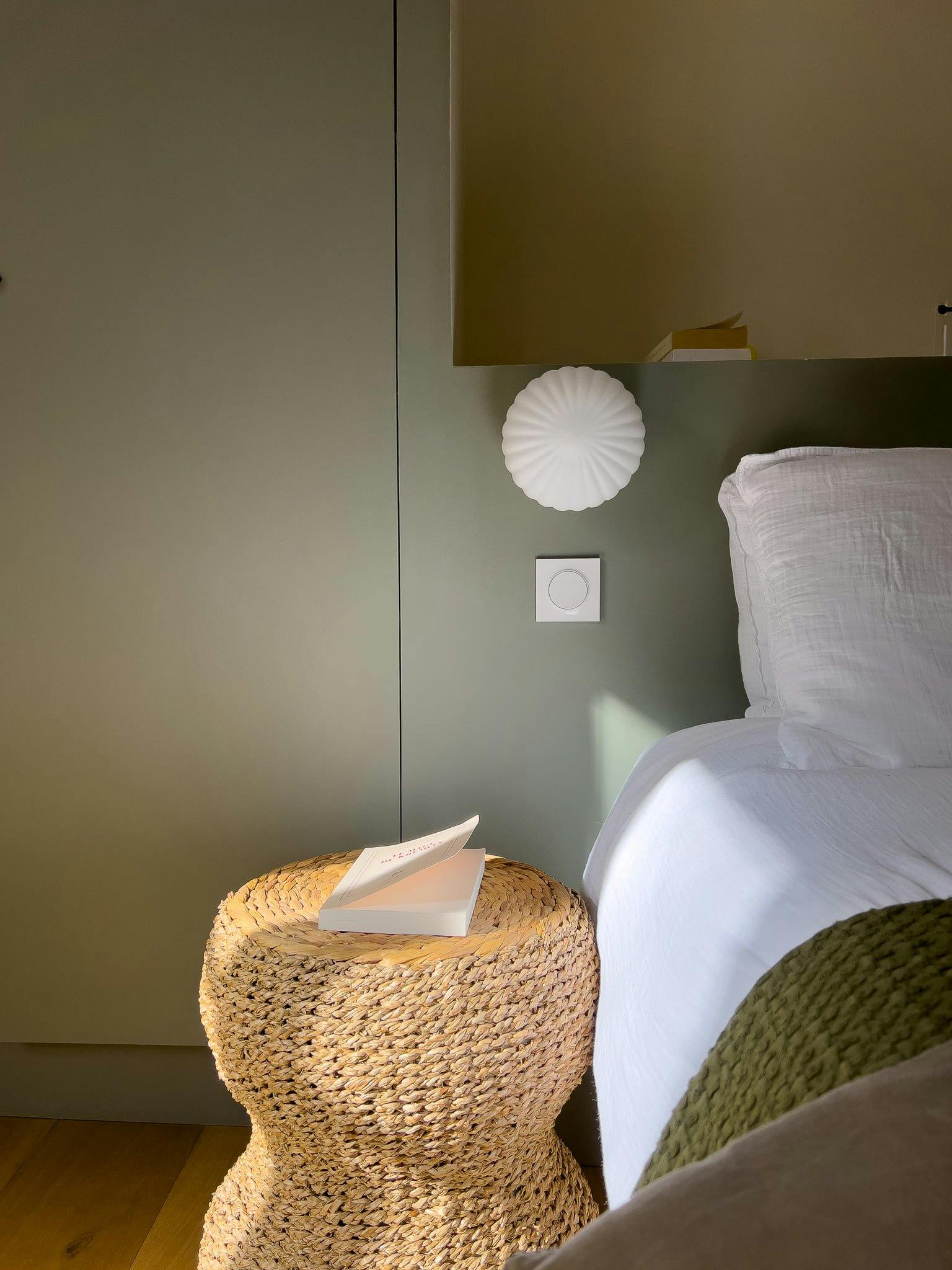 Detail of one of the bedrooms: rattan bedside table