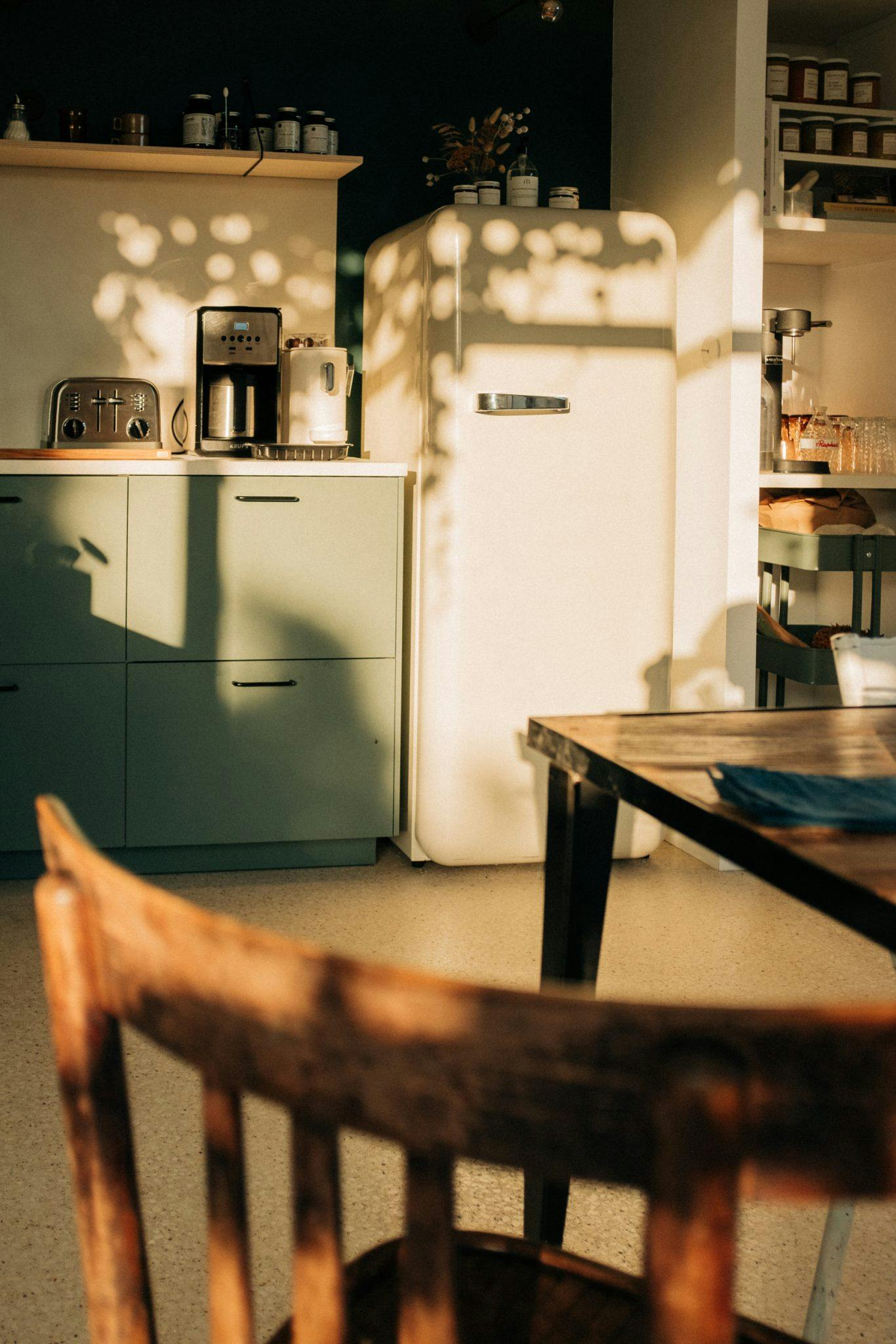 The kitchen: wooden chairs and table