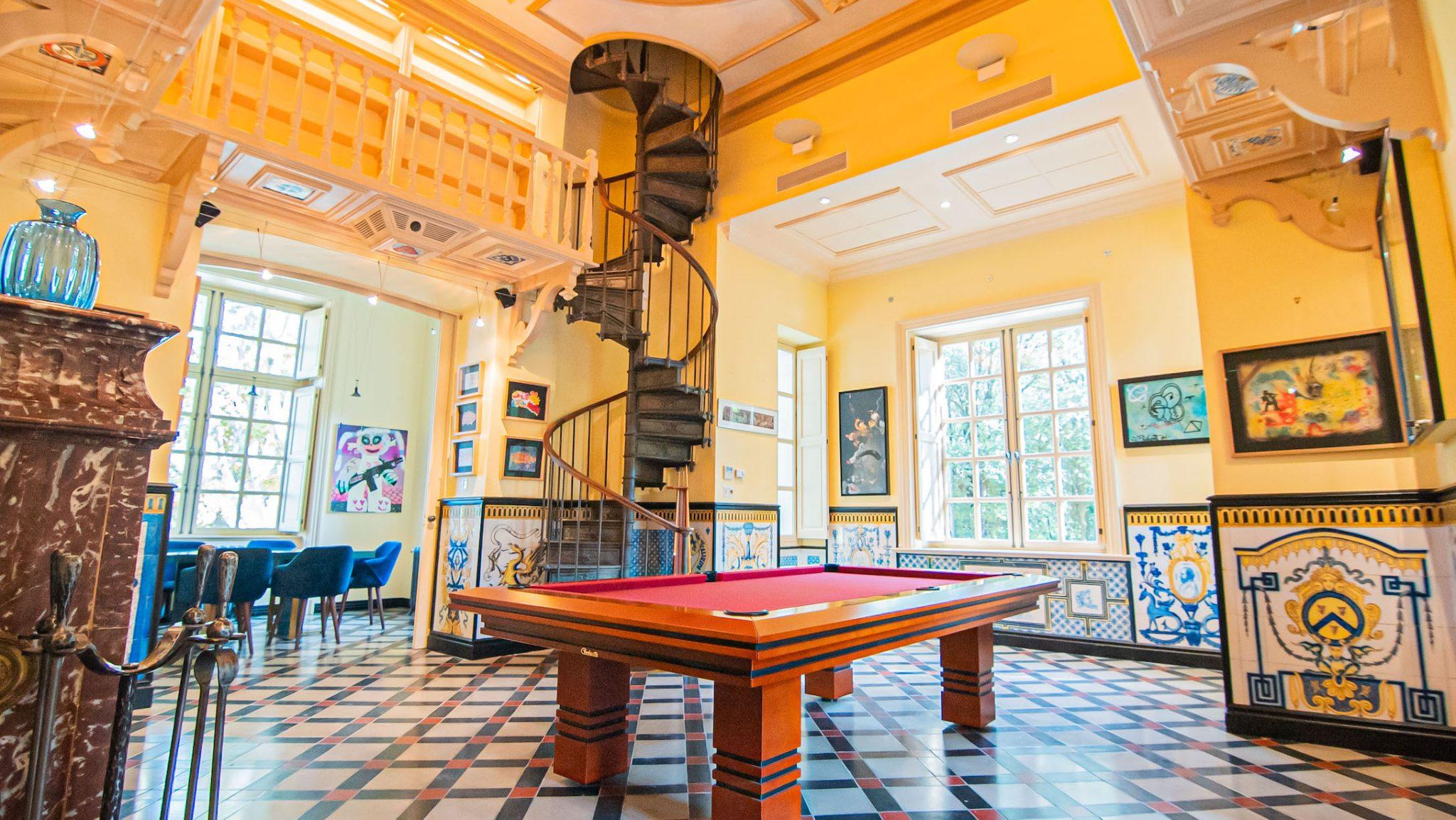 In the library, the 19th-century tiles sit alongside the staircase, which is probably signed by Gustave Eiffel.