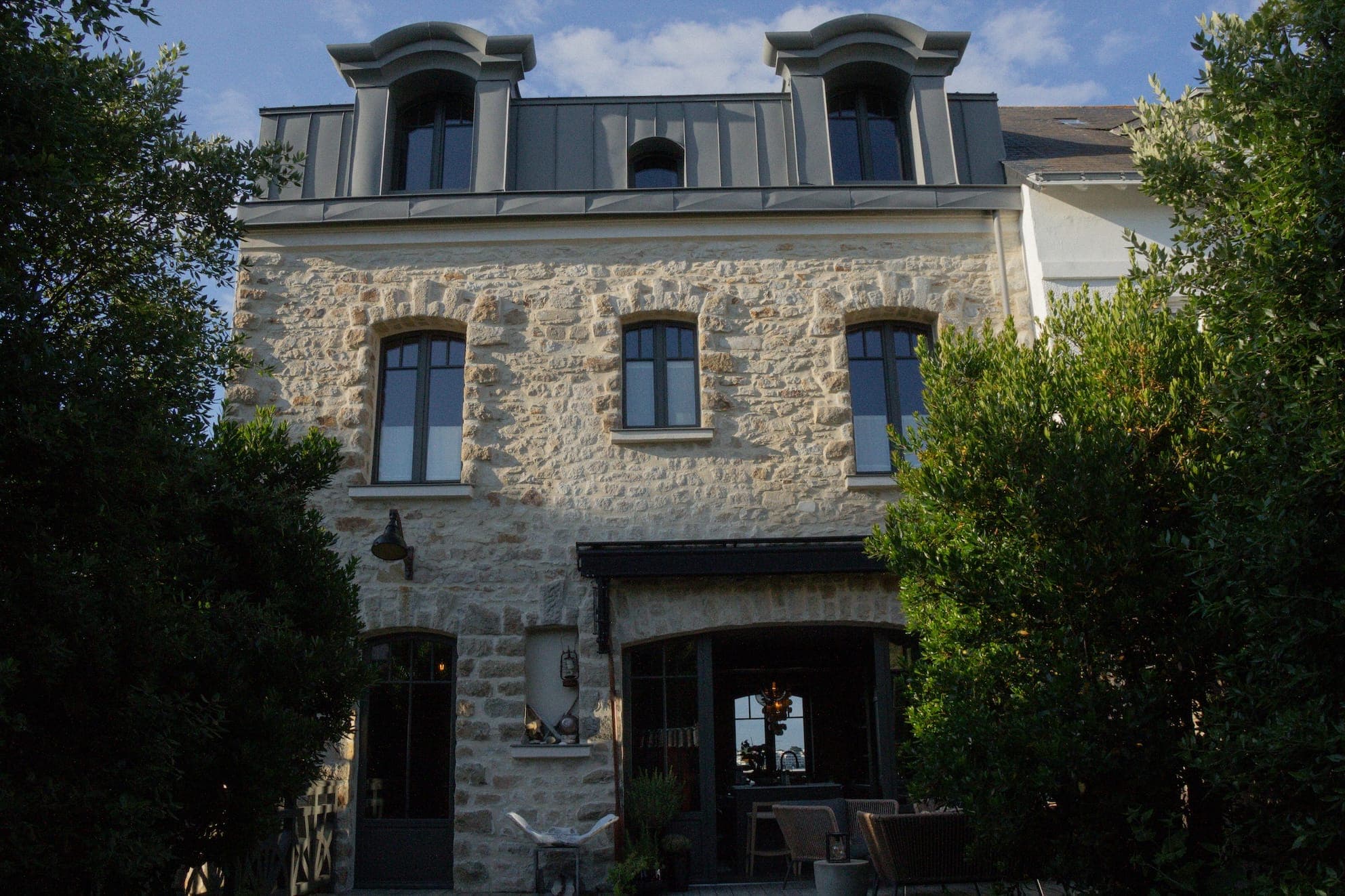 A stone building with a slate roof—a true Breton house.