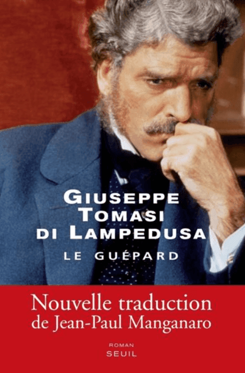 Couverture d'un livre représentant un homme pensif avec barbe et moustache, la main posée sur son menton. Le texte "Giuseppe Tomasi di Lampedusa - Le Guépard" et "Nouvelle traduction de Jean-Paul Manganaro" est inscrit sur un fond rouge.