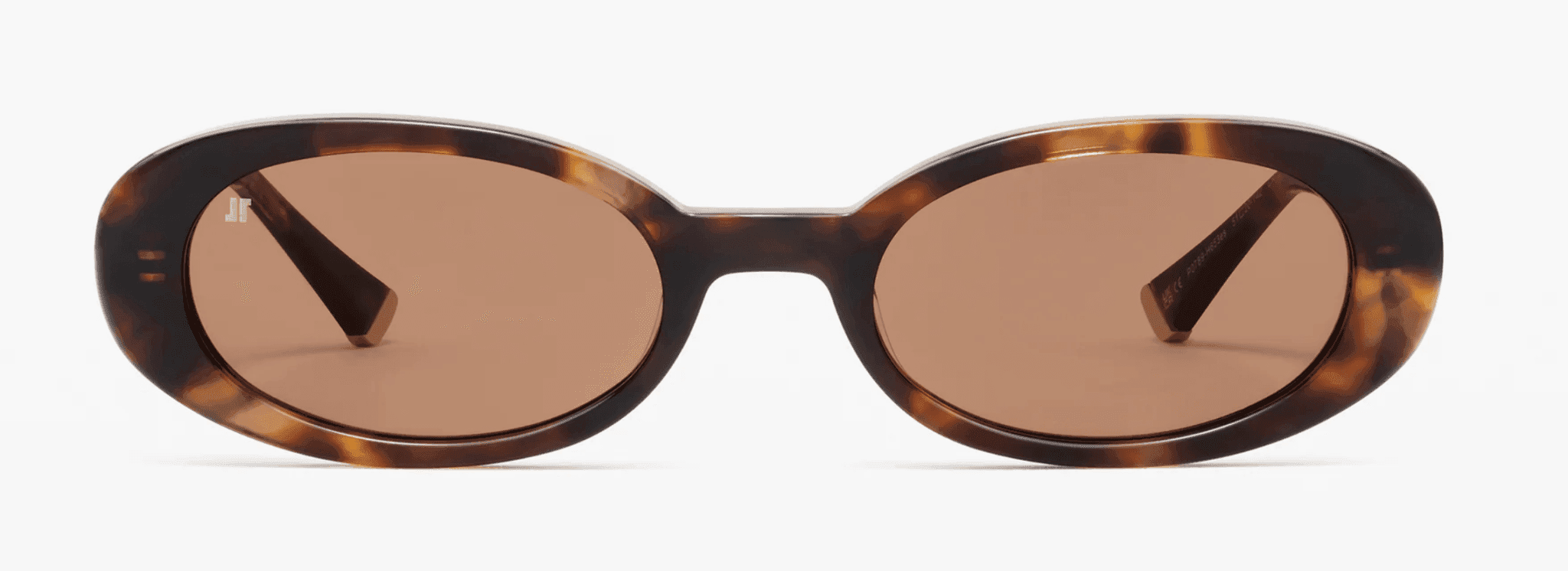 Lunettes de soleil ovales à monture écaille et verres teintés marron, vues de face sur un fond uni.