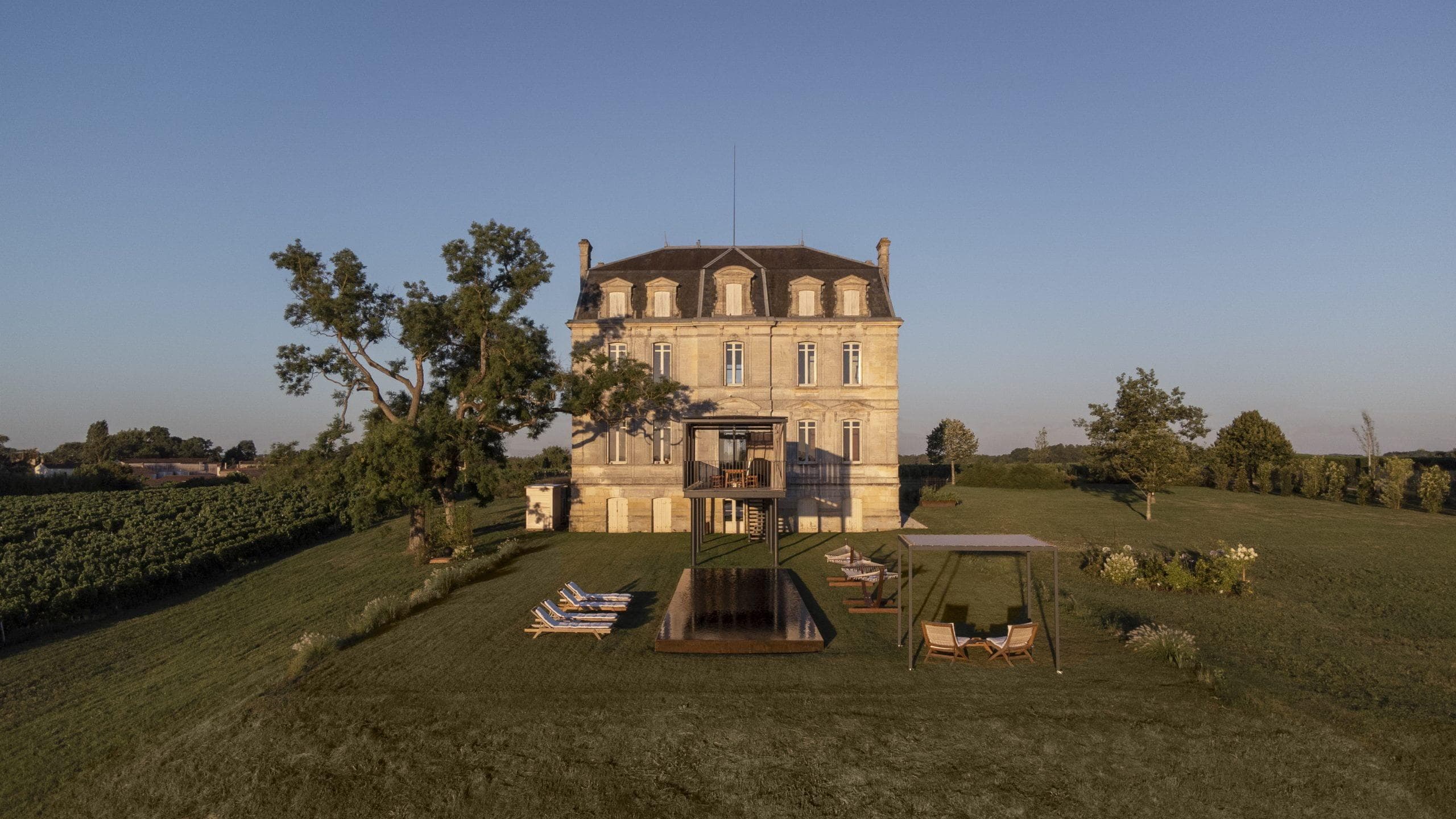 Amidst the vineyards, Château Leboscq emerges.