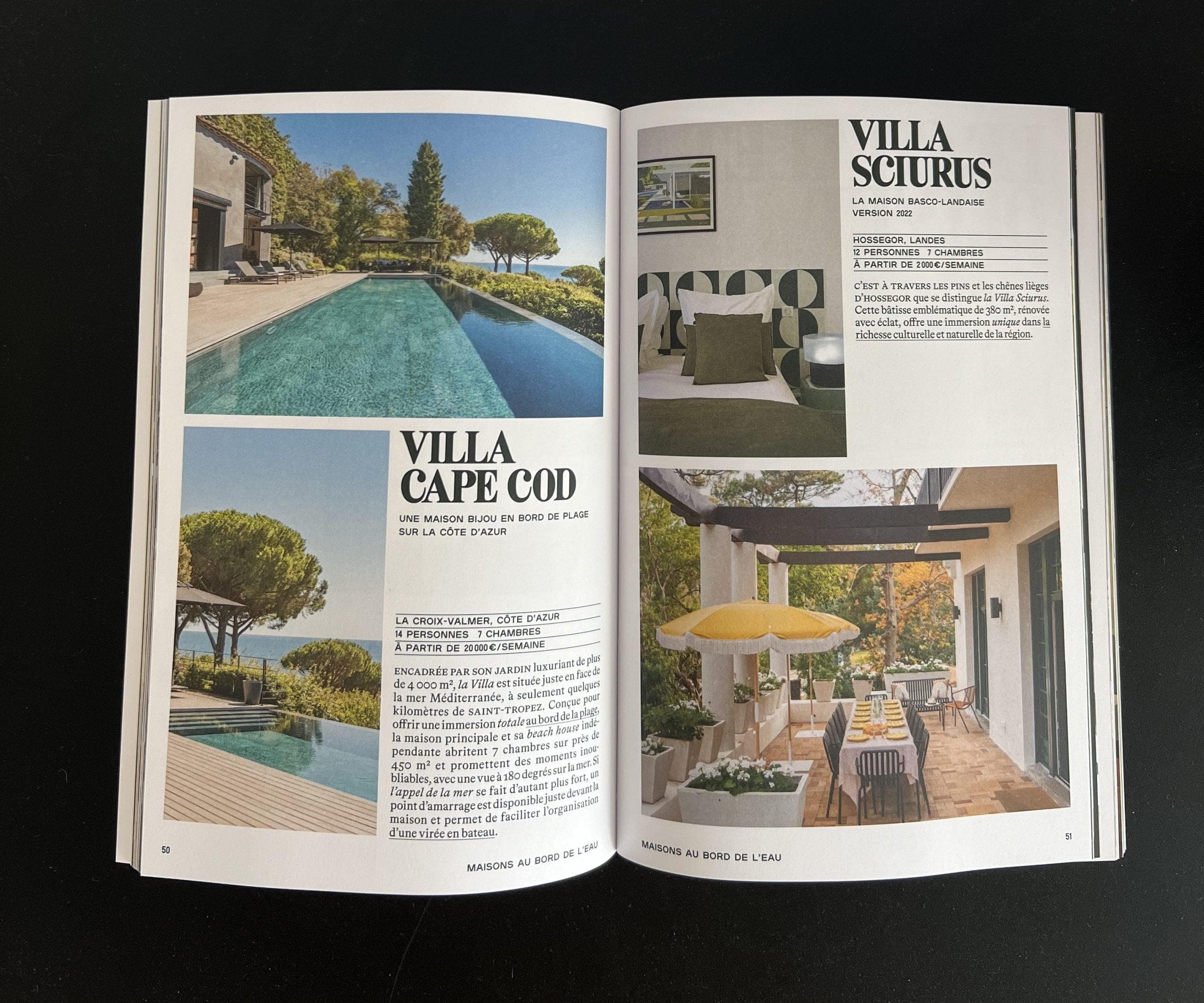 A magazine spread features photos and descriptions of two villas. The left page shows a poolside villa with pine trees, while the right page highlights a villa with a patio, outdoor dining set, and modern interior decor.