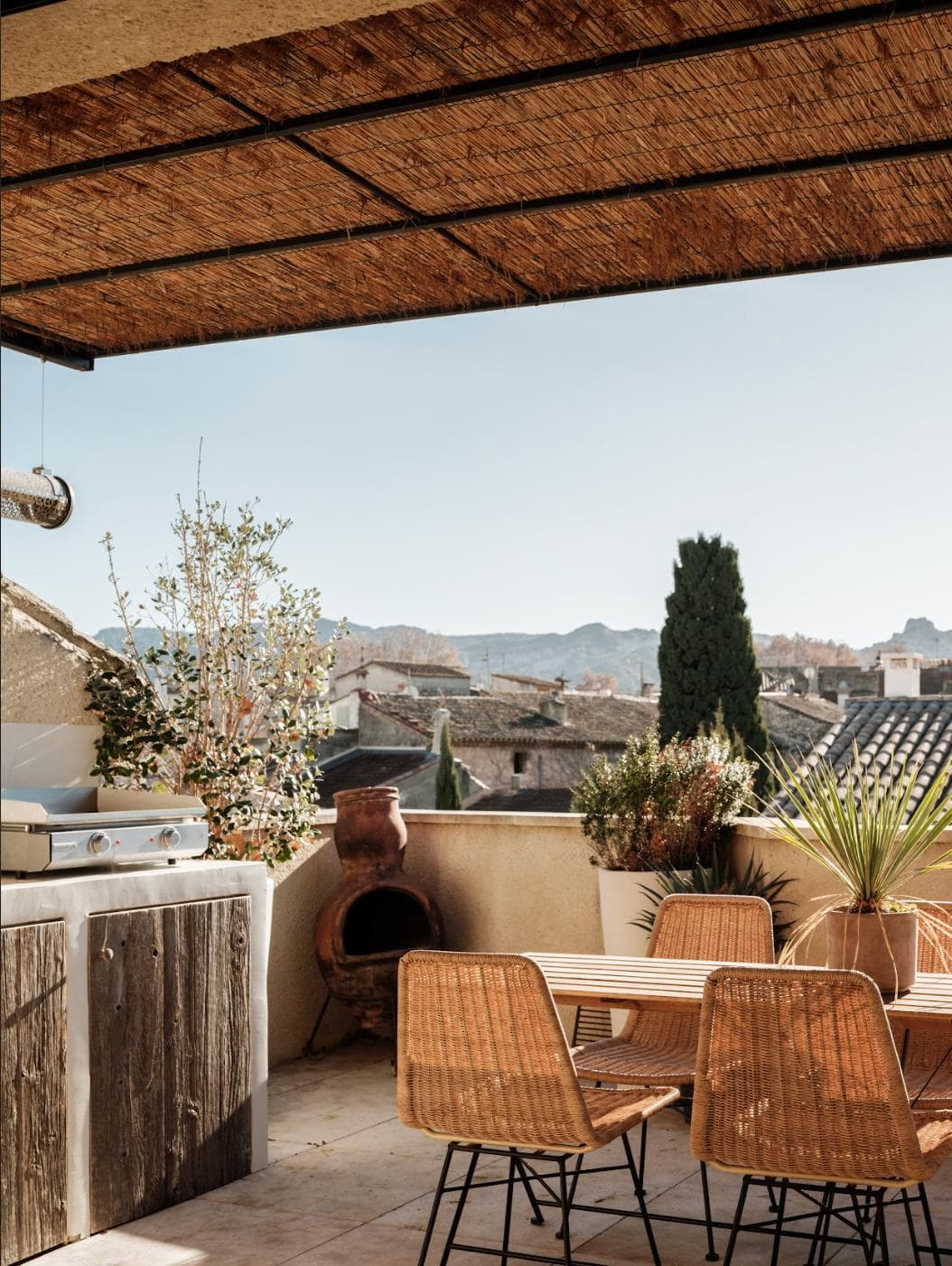 The sunlit terrace of La Maison des Remparts.