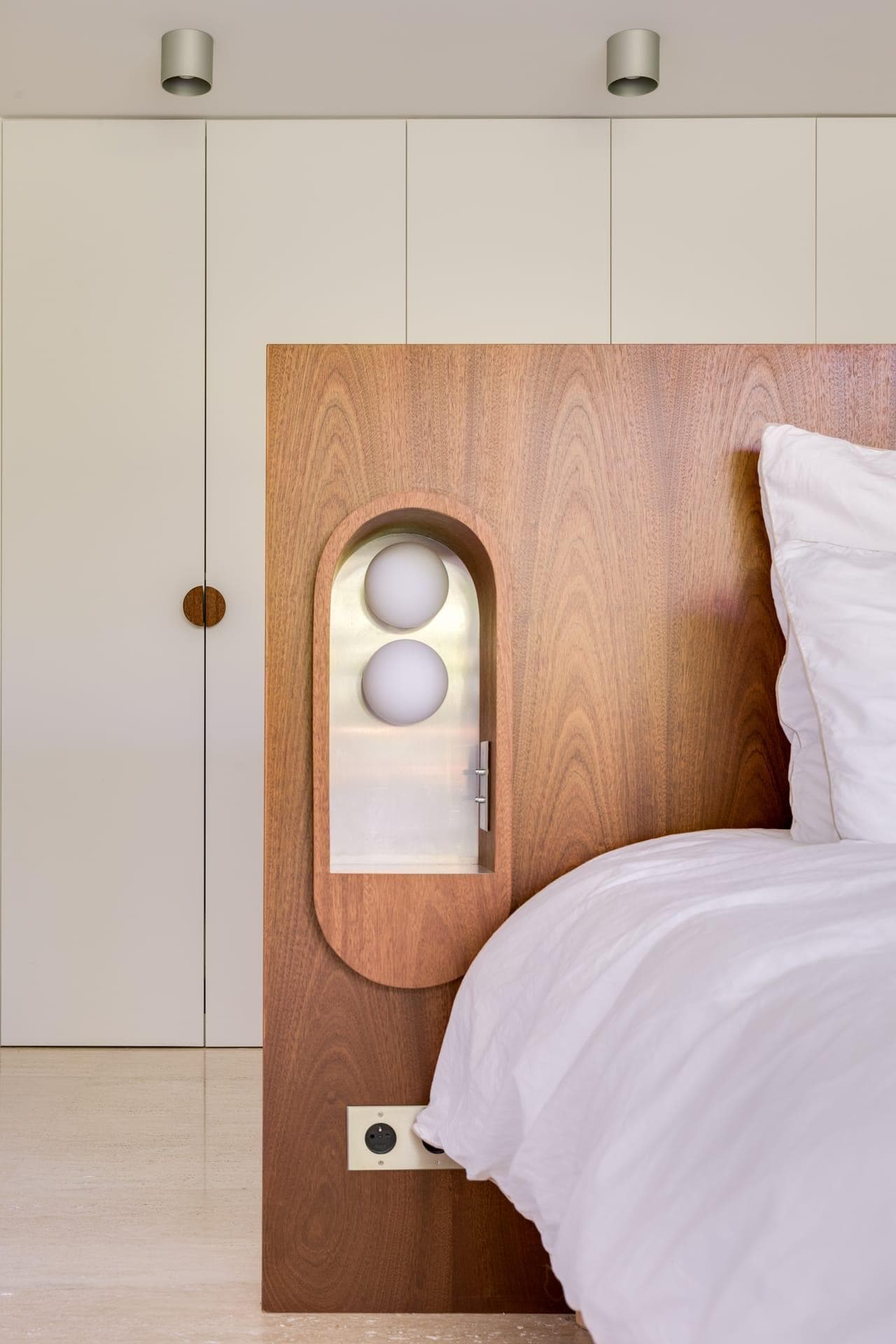The wooden headboards by Margaux Fritz.