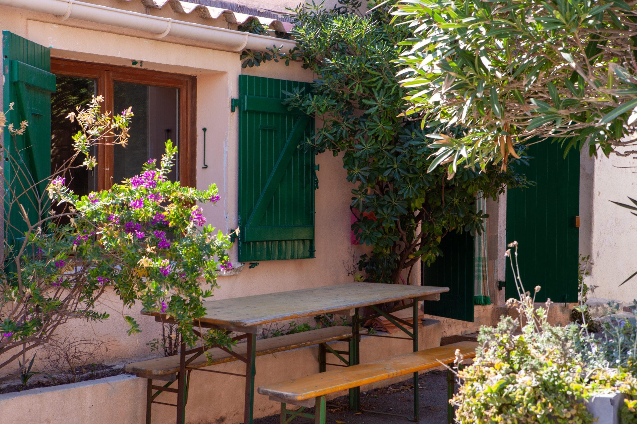 The charming flower-filled terrace of The Cabanon des Goudes.